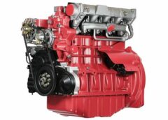 A red engine with the cylinder block removed.