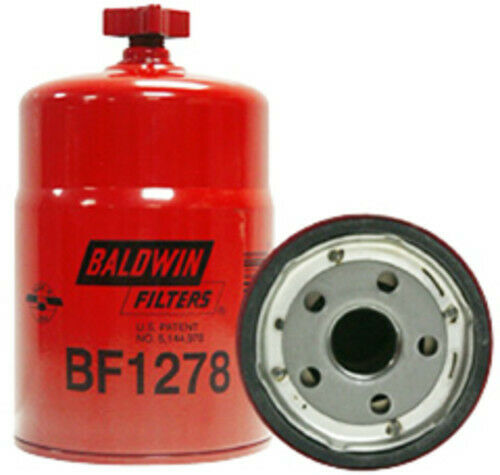 A red baldwin fuel filter and the lid of it.